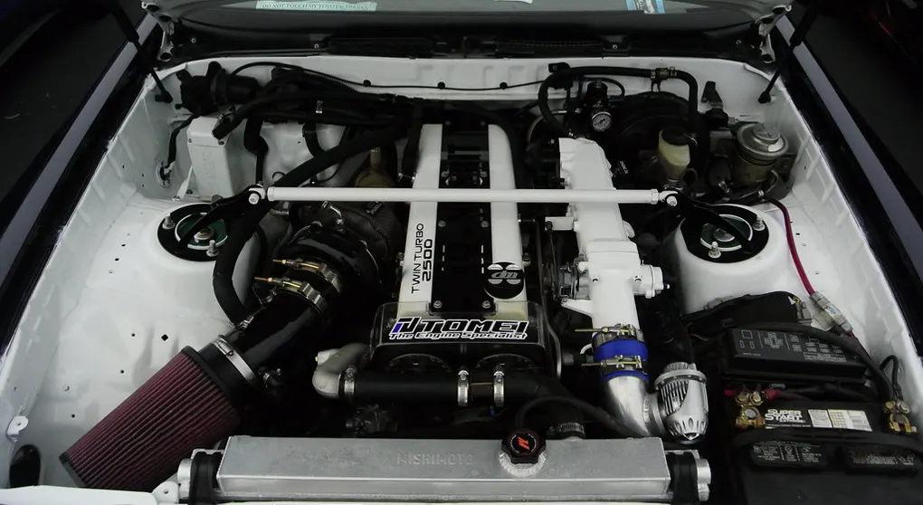 A built Toyota 1JZ-GTE twin-turbo inline-six in a white engine bay