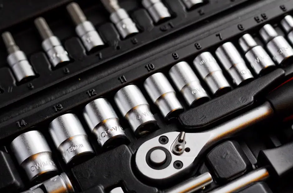 A socket set and ratchet laid out in a case